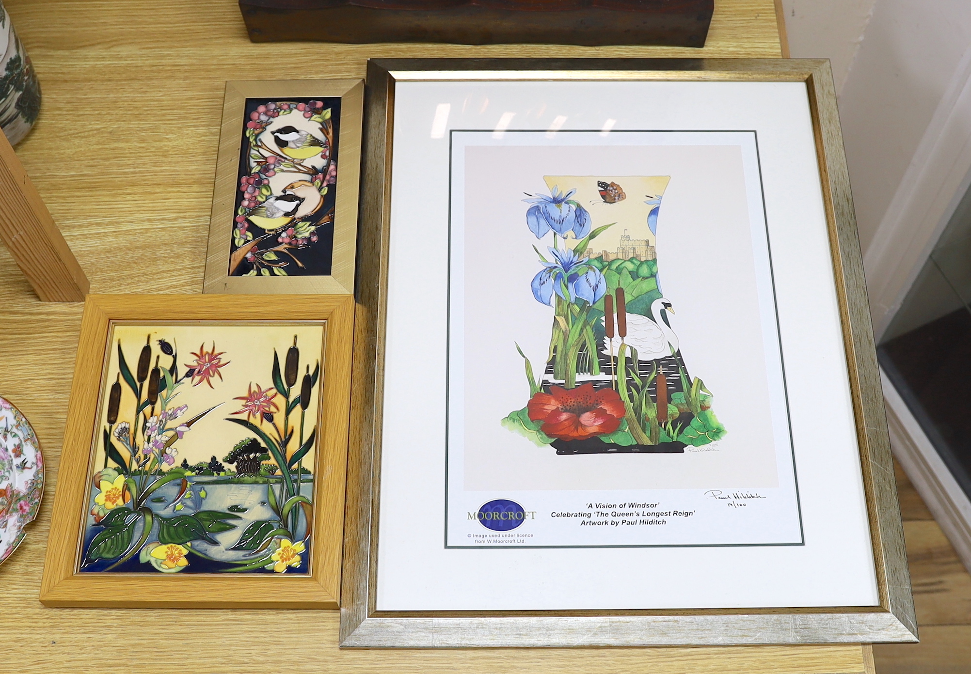 A Moorcroft Rachel Bishop wall plaque of bulrushes, another similar plaque and a signed print by Paul Hilditch, ‘A Vision of Windsor’, largest overall 60cm x 48cm